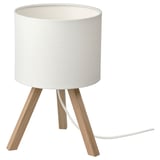White lamp with ash wood tripod legs.