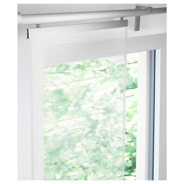 White curtain with green leaf pattern mounted on a rail, suitable for layered window solutions.