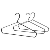 Three minimalist hangers with smooth, curved shapes and hooks, designed to keep clothes in place without leaving marks.
