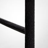 Close-up of velvet trouser hangers soft, black velvety texture, showcasing its smooth and high-quality fabric.