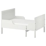 A white SUNDVIK toddler bed, made of pine and fiberboard, with a simple, rectangular design.