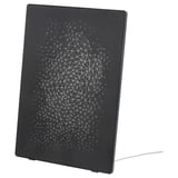 Black, rectangular ikea SYMFONISK wifi speaker with geometric, white graphic design, standing upright.