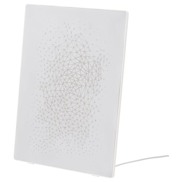 White SYMFONISK speaker, blend of picture frame and wifi speaker, sleek rectangular design.
