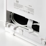 A modern, white ikea SYMFONISK wifi speaker in pristine condition, partially unboxed with visible cords and packaging.