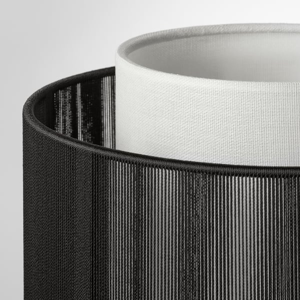 Close-up of black & white SYMFONISK lamp shades, showcasing texture & quality.