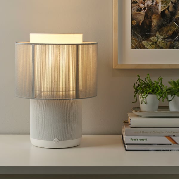 Modern desk lamp with wi-fi speaker; emits soft light and quality sound, enhancing home ambiance.