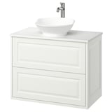 Modern white wall-mounted bathroom vanity with rounded wash-basin and chrome faucet.