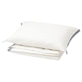 Stacked white cotton duvet covers with gray trim.