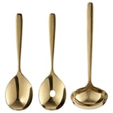 Three brass-colored TILLAGD utensils: a spoon, a ladle, and a serving spoon, each made of stainless steel with a sleek and elegant design.
