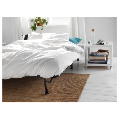 A white TINGBY rolling side table with a square top and bottom shelf, four wheels, and a minimalist design.