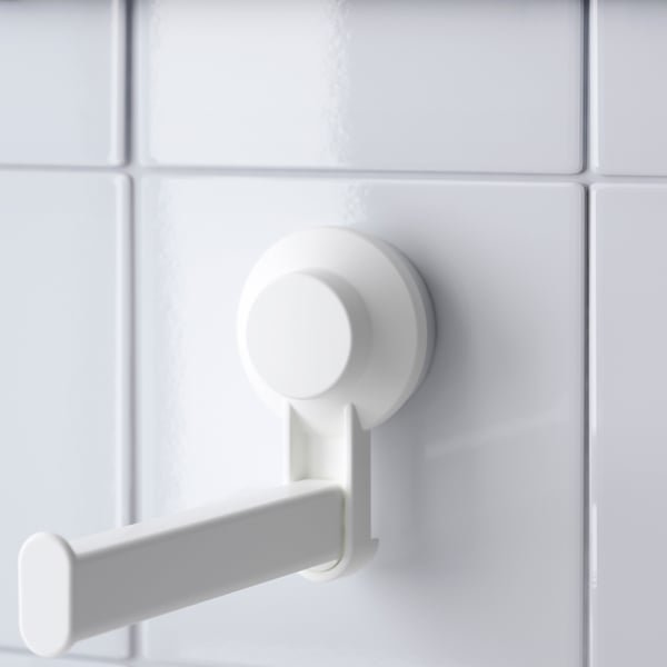 White suction-cup mounted towel hook on tiled wall, showcasing sturdy design and easy installation.