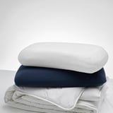 TÖCKENFLY pillowcases - white & navy with elastic edges. White is larger.