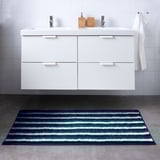 Floating vanity with TOFTBO striped mat, quick-dry & recycled.
