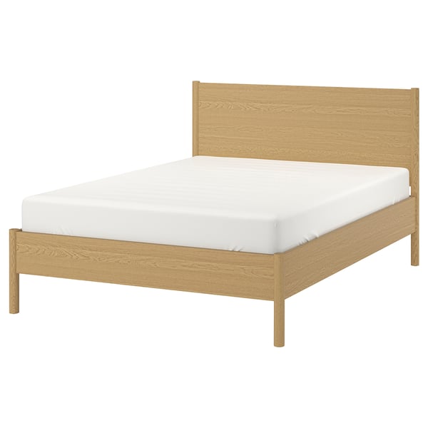 A TONSTAD bed with a light oak finish, featuring a clean, minimalist design with a rectangular headboard and adjustable bed sides.