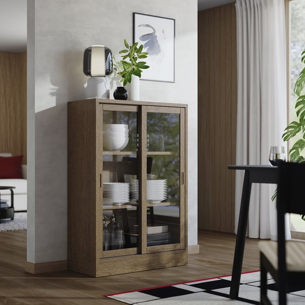 Wooden display cabinet with glass doors showing dishes, a vase, and decor items.