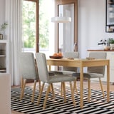 Modern TONSTAD dining set with light wood table, grey chairs, striped rug, pendant lamp, light curtains.