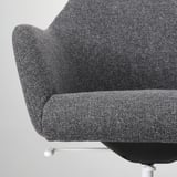 Close-up of a modern gray office chair, showcasing its smooth upholstery and contoured padding.