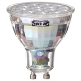 Ikea TRÅDFRI led smart light bulb, clear, round shape with metallic base.