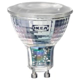 Ikea TRÅDFRI led light bulb, clear, rounded top, textured design, polycarbonate plastic cover.