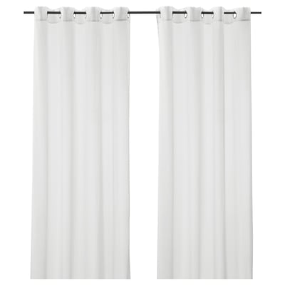 Two white, sheer curtains hang side by side, each with metal grommets at the top, providing privacy while allowing light through.