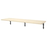 A beige wooden wall shelf called TRANHULT. It has three dark metal brackets supporting it, offering a modern and simple look.