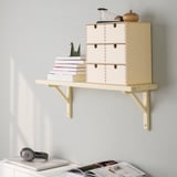 Wall-mounted light wood shelf holding books, a record player, and decor. Part of the TRANHULT series.