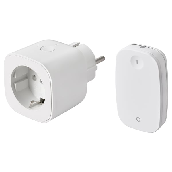 Two white smart plug and remote control devices by ikea, one with a power outlet, the other with an on/off button.