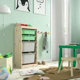 TROFAST storage: light wood, green & white bins, kids room, with coat hooks.