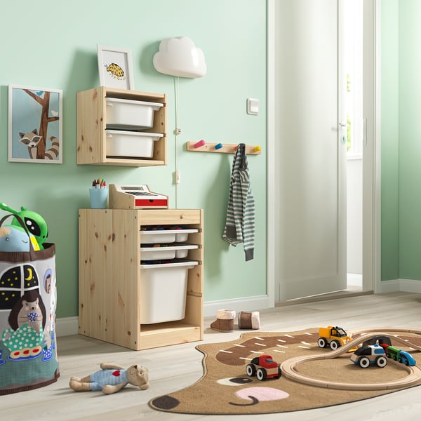 Kids room with TROFAST storage, toys, & lamp over car mat.