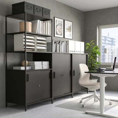 Black trofast cabinet room divider, workspace with desk & laptop.