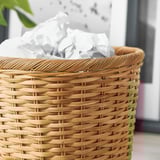 Wicker basket with white liner, handwoven, sturdy handles.