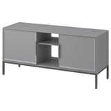 A grey TULLSTORP tv stand with metal legs and bevelled doors, combining open and closed storage for organized cable management.