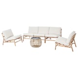 TVARÖ outdoor furniture set: light beige cushioned rattan sofa and two chairs with glass-top table.