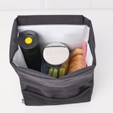Insulated tumbler in bag, suitable for cars, secure grip, spill-proof lid.