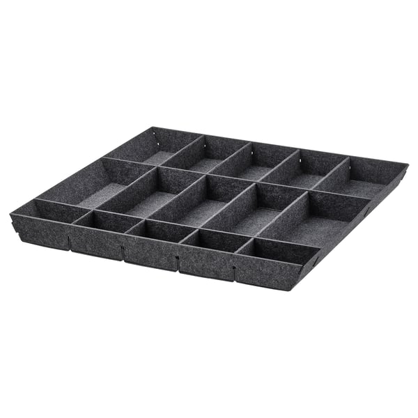 A black UPPDATERA drawer organizer with multiple compartments for storing kitchen items.