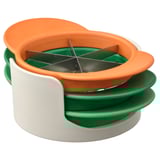 The UPPFYLLD fruit cutter, an orange and green kitchen tool with stainless steel blades, designed to slice and dice fruits safely and efficiently.
