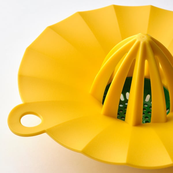 Bright yellow plastic lemon squeezer with a handle and multiple ridges to extract juice efficiently.
