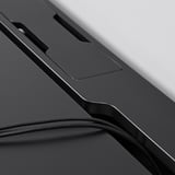 Close-up of durable, matte desk surface, showing sleek design and cable management slot, emphasizing quality and functionality.