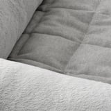 Cozy dog bed with soft, textured fabric, plush cushioning, and anti-slip bottom for comfort and safety.