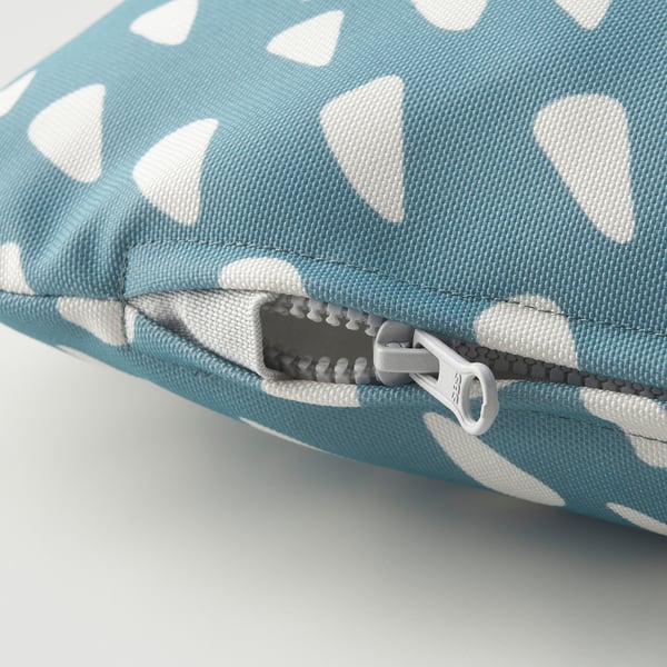 A close-up of a blue and white patterned dog cushions zipper, showcasing its durable and high-quality fabric.