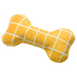 A yellow bone-shaped dog toy with white grid patterns, made from recycled polyester.