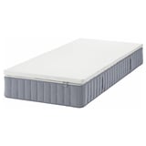 IKEA VALEVÅG gray pillow-top mattress with white texture.