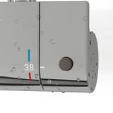 Close-up of thermostatic shower mixer with 38°c safety stop button.