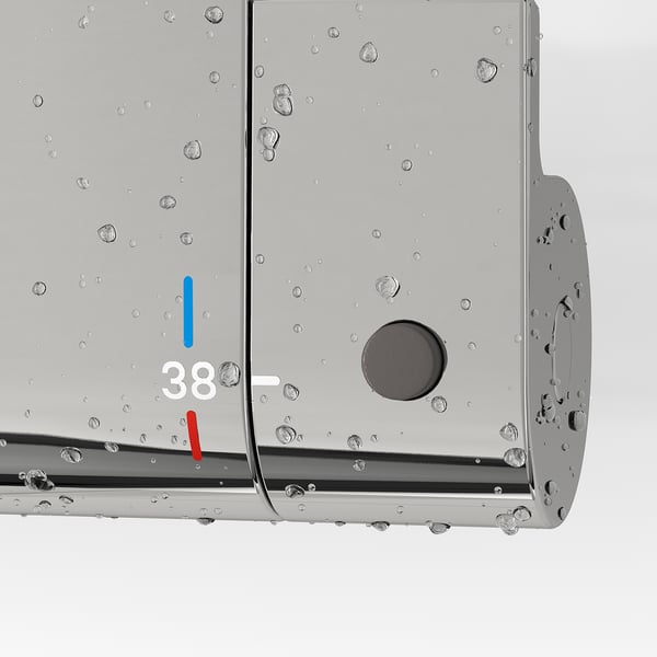 Close-up of chrome thermostatic shower mixer with safety stop at 38°c, featuring temperature controls and water droplets.