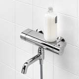 Modern chrome shower mixer with thermostatic control, built-in shelf for bottles.
