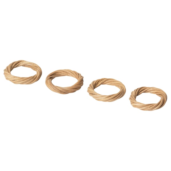 Four handwoven beige rattan napkin rings in a row.