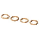 Four handwoven beige rattan napkin rings in a row.