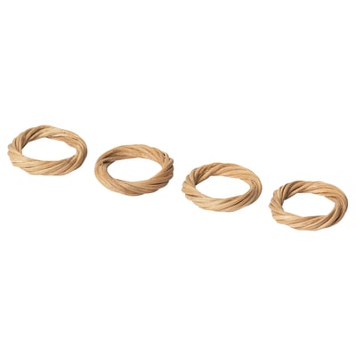 Four handwoven beige rattan napkin rings in a row.