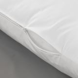 Close-up of white zippered pillow cover, showcasing quality fabric and detailed stitching.