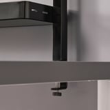 Black shelf unit on table, adjustable with scratch protection.